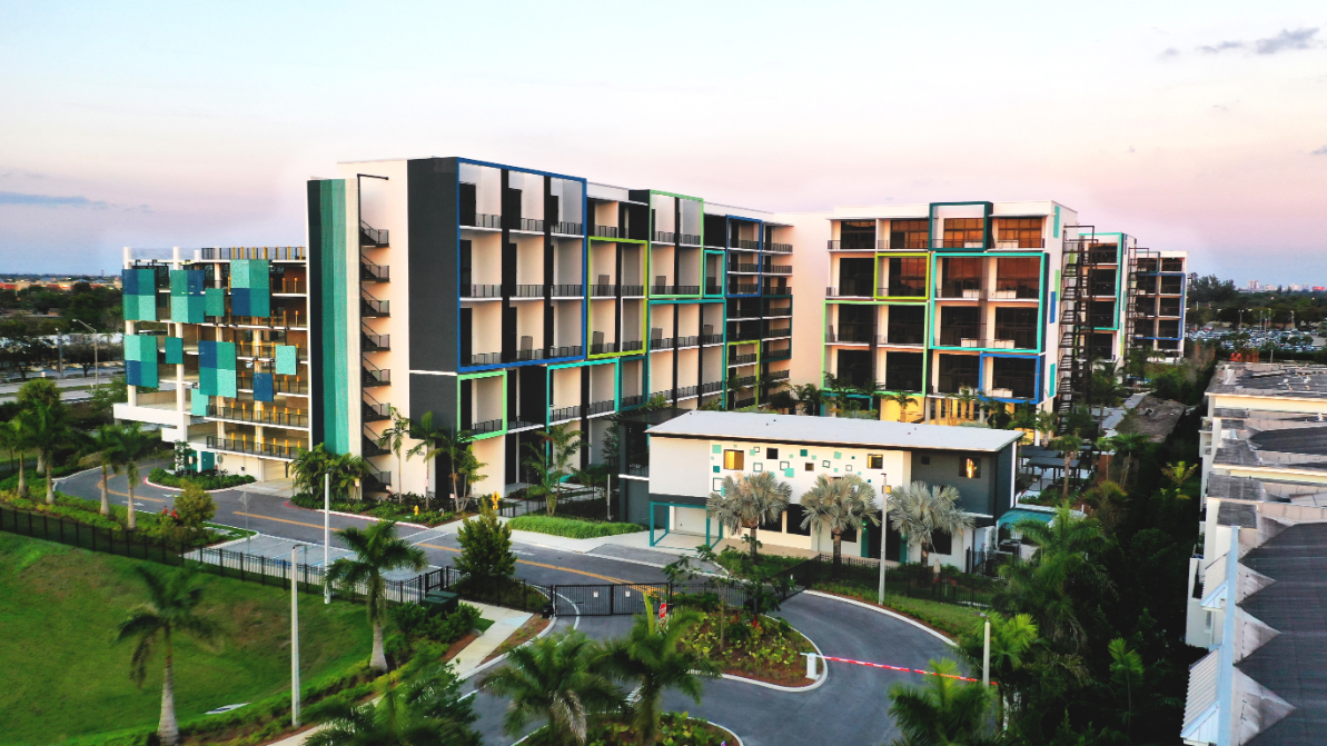 PIXL Apartments courtyard exterior in the evening